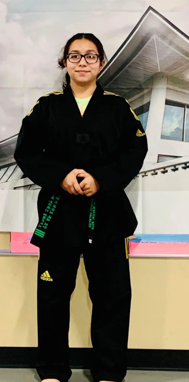 Instructor Elide Ara demonstrating martial arts technique